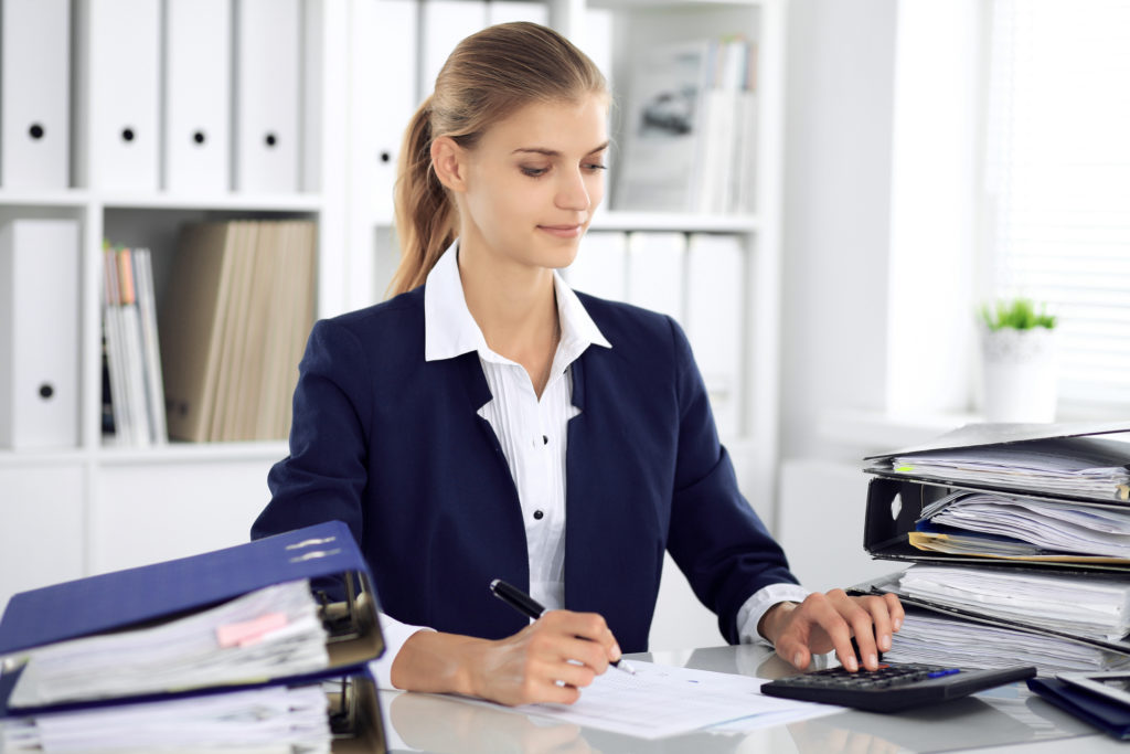 Modern business woman or confident female accountant in office. Student girl during exam preparing. Audit, tax service or education concept